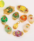 Top Shelf Sand Gold Inlay Stone DIY Jewelry Beads Featuring Braided Rope Accents And Durable Baking Lacquer Coating For Fly Bracelets Necklaces And Badass Pendant Spacers Pack Of 10 assorted colorful beads with gold accents.