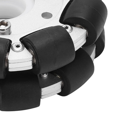 Close-up of a 100mm aluminum omni wheel with rubber rollers on a metal housing