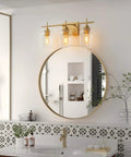 Three Light Bronze Vanity Light Fixture With Glass Shade Over Mirror Wall Sconce for modern bathroom decor.