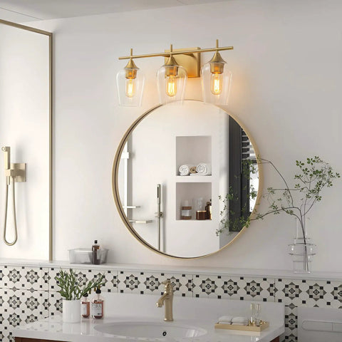 Three Light Bronze Vanity Light Fixture With Glass Shade Over Mirror Wall Sconce for modern bathroom decor.