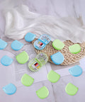 20 Pack Mini Travel Sewing Kit Set For On The Go Repairs With Scissors Needles Thread Spools And Emergency Fix Essentials In Durable Blue And Green Case shown open on a wicker surface