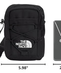 Jester Crossbody Bag Dope Everyday Carry Sling With Water-Repellent Fabric next to a smartphone for size comparison.