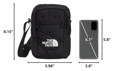 Jester Crossbody Bag Dope Everyday Carry Sling With Water-Repellent Fabric next to a smartphone for size comparison.