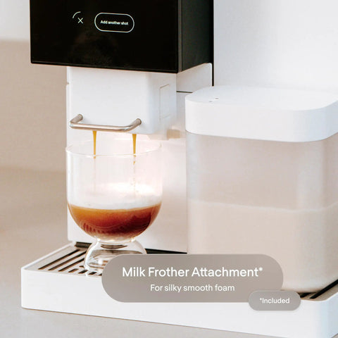 Next Level Super Automatic Espresso Machine Delivering One Hundred Thousand Custom Drink Combos And Creamy Milk Froth For That Straight Fire Daily Grind Routine In Classic Black pouring espresso into a glass.