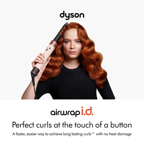 Woman using Limited Edition Airwrap iD Multi Styler And Dryer Straight Plus Wavy In Jasper Plum for styling curls.