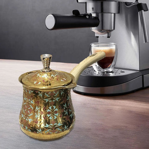 Versatile Milk Warmer And Coffee Pot With Long Handle Teapot Kettle 720ml next to espresso machine on kitchen counter