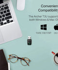 AC1300 USB WiFi Adapter Archer T3U Dual Band Wireless Dongle next to laptop and glasses, showing compatibility with Windows and Mac OS.