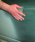 Hand using Color Prep Scuff Pad For Auto Body And Paint Shop, Gray Hand Pad For Fast Scuffing And Fine Finish on car panel