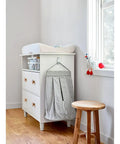 Nursery room with dresser using Large Utility Hook Mega Pack 14 Count For No Fuss Damage Free Hanging Holds Strong On Painted Walls Wood Tile And More Fast Easy To Hang Removes Cleanly Ideal For Garage Kitchen And Bathroom Organization.