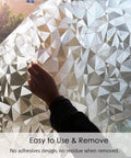 Hand applying 3D No Glue Window Privacy Film With Frosted Glass Look, Static Cling Installation, showing rhombus pattern.