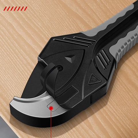 Close-up of PVC Pipe Cutter 33mm Opening Heavy Duty Handheld Plastic Tube Cutter For PVC And Drainage Pipes on wooden surface