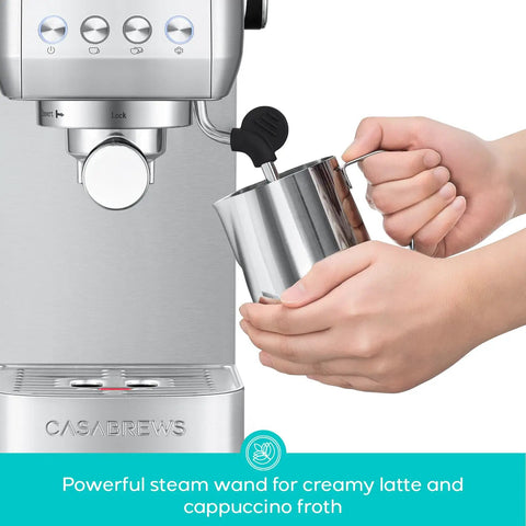 Hands using milk frother on Essential Espresso Machine With 20 Bar Pressure, Stainless Steel Build, Milk Frother For Home Use, Brew Barista Grade Lattes And Cappuccinos, And More, 43.9oz Water Tank, Sleek Silver Coffee Maker