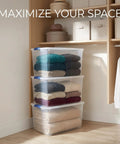 Hella Tough 66 Quart Clear Plastic Storage Bins With Secure Twist Latches And Smart Stack Design stacked with folded sweaters.