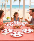 Family enjoying a seafood meal using Heavy Duty 50 Pack Crab Boil Paper Plates 9 Inch Round Disposable Dinnerware.