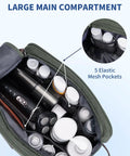 Large green mens travel toiletry organizer bag with canvas and leather dopp kit, open top view showing elastic mesh pockets and bottles