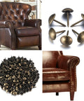 Premium 320 Piece Set Of Top Shelf Upholstery Tacks Featuring A Knockout Antique Brass Finish and Smooth Round Heads displayed with leather armchair.