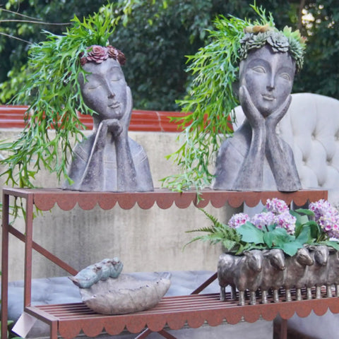 Two gray face head planter pots for succulents and small plants with drainage hole, big farmhouse vibe decor outside on shelf