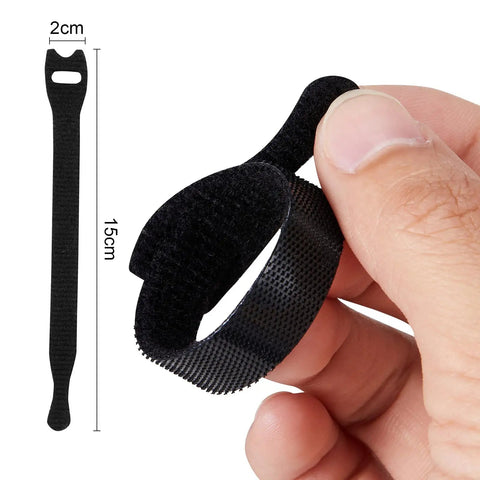 Hand holding 15cm reusable cable tie, black nylon, shown next to size diagram. 100 Pack Reusable Cable Ties And Straps, 6 Inch By 0.47 Inch Thin Cord Organizers With Hook And Loop For Quick Home Office And Data Centers, Black