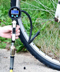 Using FlowPro 2.0 Digital Tire Inflator With Pressure Gauge 200 PSI on bicycle wheel