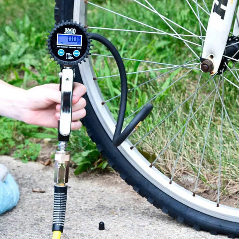 Using FlowPro 2.0 Digital Tire Inflator With Pressure Gauge 200 PSI on bicycle wheel
