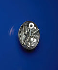 Magnetic dish holding screws and washers from Three Piece Magnetic Tray And Pick Up Tool Set With Magnetic Dish Extendable Magnet Pickup Tool And Telescoping Mirror Reaching Up To Nineteen Inches A Handy Garage And Shop Essential For Small Parts And Lost Screws on a blue surface.