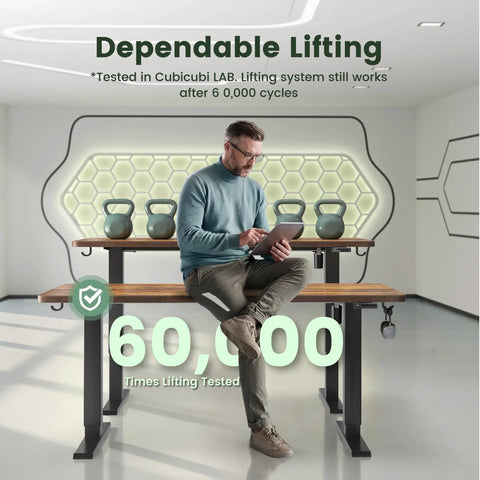 Man seated on 55 By 28 Inch Roomy Electric Standing Desk With A 28 Inch Deep Desktop Sit Stand Home Office Workspace Four Preset Heights Height Adjustable Frame Rustic Brown in lab setting, showing durability.
