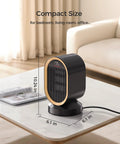 Indoor Space Heater 1500W Ceramic PTC With Thermostat And 24Hour Timer on a table in living room, compact black design