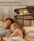 Premium Caged Ceiling Fan And Light With Remote Flush Mount Farmhouse Style Bladeless Design For Kitchen Bedroom Total Game Changer Industrial Black Decor That Brings Dope Modern Flow To Your Space above a couple sleeping.