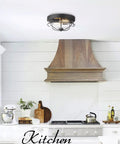 12 Inch 2 Light Farmhouse Flush Mount Ceiling Light With Seeded Glass Shade In Sand Black Finish in a kitchen setting