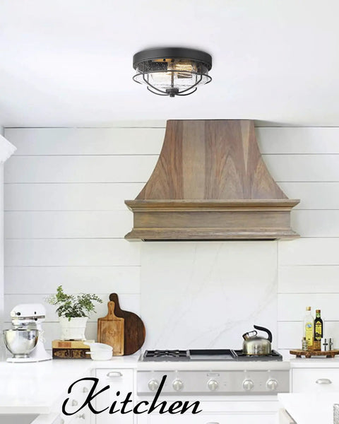 12 Inch 2 Light Farmhouse Flush Mount Ceiling Light With Seeded Glass Shade In Sand Black Finish in a kitchen setting