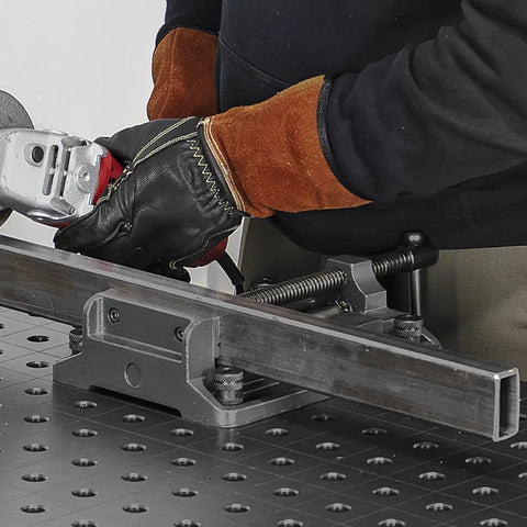 Worker using Heavy Duty Drill Press Vise Six Point Three Inch Opening Rock Solid With 3000 Lb Clamping Force Portable Bench Vise