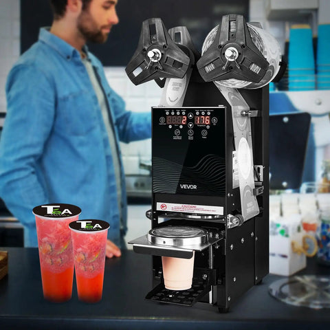No Fuss Fully Automatic Cup Sealer Pumping Six Hundred Cups Hour With Digital Control Panel sealing cups in a coffee bar.