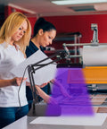Two people using 60W UV Screen Printing Exposure Light With Adjustable Stand Pro Grade Kit in a workshop setting