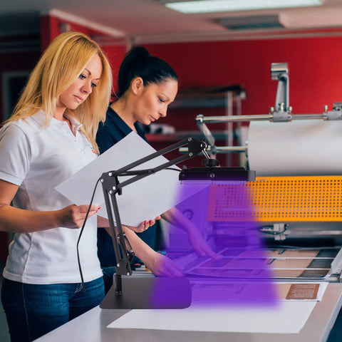 Two people using 60W UV Screen Printing Exposure Light With Adjustable Stand Pro Grade Kit in a workshop setting