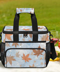 Insulated Picnic Backpack With Lunch Box For Women And Men Portable Tote with leaf design on a picnic blanket.