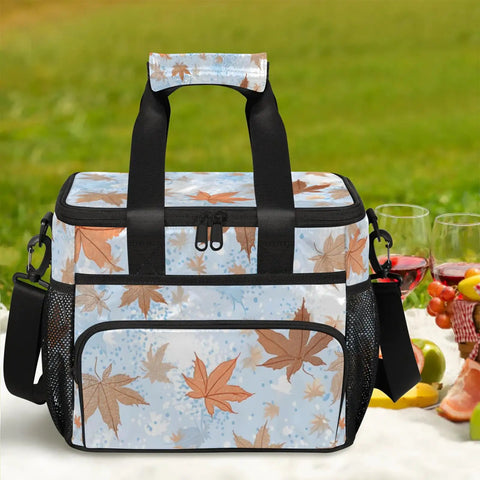 Insulated Picnic Backpack With Lunch Box For Women And Men Portable Tote with leaf design on a picnic blanket.
