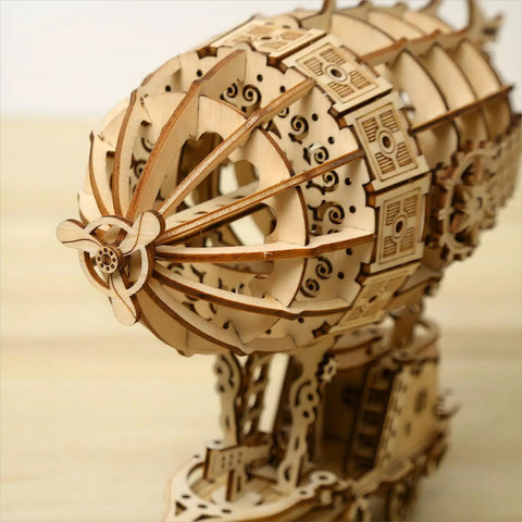 Close-up of intricate 3D wooden airship puzzle kit for adults and teens, showcasing detailed laser-cut design of the model.