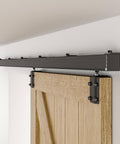 Six Foot Box Rail Sliding Barn Door Hardware Kit Aluminum Alloy Wall Mount Heavy Duty For Single Door Smooth Ball Bearing Rollers For Quiet Glide Supports Up To 330 Lb Fits Door Thickness One Inch To One And Three Quarter Inches installed view