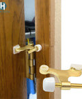 Solid Five Pack Of Heavy Duty Hinge Pin Door Stoppers In Premium Satin Brass Matte Gold Finish installed on a door.