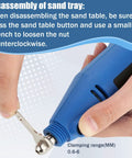 Disassembling sand tray with blue handheld tool and wrench for Heavy Duty Tungsten Sharpener Grinder For TIG Welding With A Straight Shooting Four Angle Rotary System And Dead On Precision Flat Grinding Block Featuring Nine Double Sided Diamond Wheels Plus Cnc Mandrels And Snappy Fit.