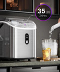 Chewable Nugget Ice Maker Countertop 35 Lbs Per Day Portable Sonic Ice Machine with self cleaning next to glass
