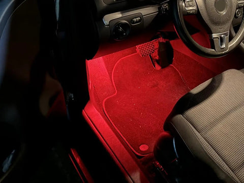 Kickin Red LED Glove Box And Footwell Lights illuminating Volkswagen interior with bright red glow
