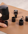 Leather Circle Cutter Tool Set With 25 Pcs Hole Punch Die Carbon Steel Punching Kit for DIY projects on leather surface.