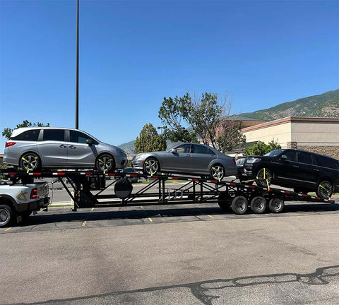 Vehicles secured with 4 Pack Beefed Up Heavy Duty 2 Inch By 10 Foot Wheel Straps With Flat Hooks on trailer for hauling