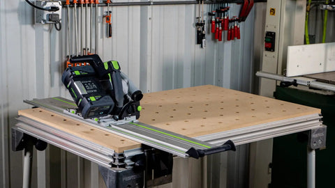 Top Tier Mft Replacement Top With Killer Perforated Layout Fits Right Into Bench Dog T Slot Rail System Knockout Construction Three Quarter Inch Mdf Board American Crafted Super Smooth Double Sided Workshop Platform on workbench with saw.