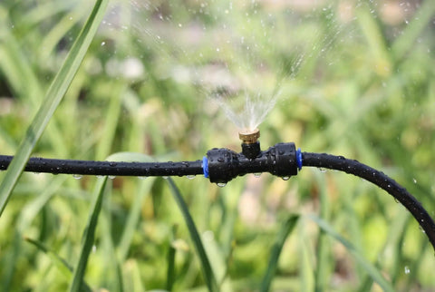 Misting System For Outdoor Patio And Garden With 20 Brass Nozzles, 59 Ft Tubing, Three Quarters Inch Brass Adapter, spraying water
