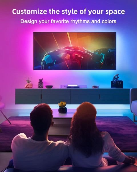 Couple enjoying vibrant colors from Lit RGB LED Strip Kit 32.8 Feet With 300 LEDs 5050 SMD in a home theater setup.