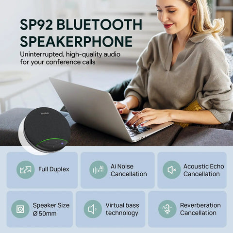 Woman using laptop with SP92 Plug And Play Conference Speaker And Microphone With AI Noise Cancellation beside her.