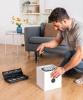 Man using Top Shelf Electric Screwdriver With Pivoting Handle And Crisp Digital Torque Display Featuring Eight Precise Settings For Laptop Repair And Diy Tasks That Deliver Knockout Precision Every Time to assemble a device.