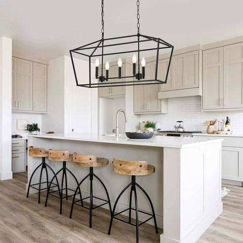 Farmhouse Five Light Candle Pendant Chandelier in Matte Black over kitchen island, industrial rustic ceiling light fixture